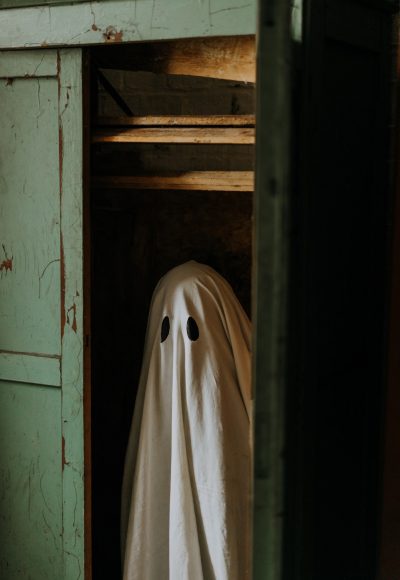 little-ghost-standing-in-the-closet-autumn-halloween.jpg